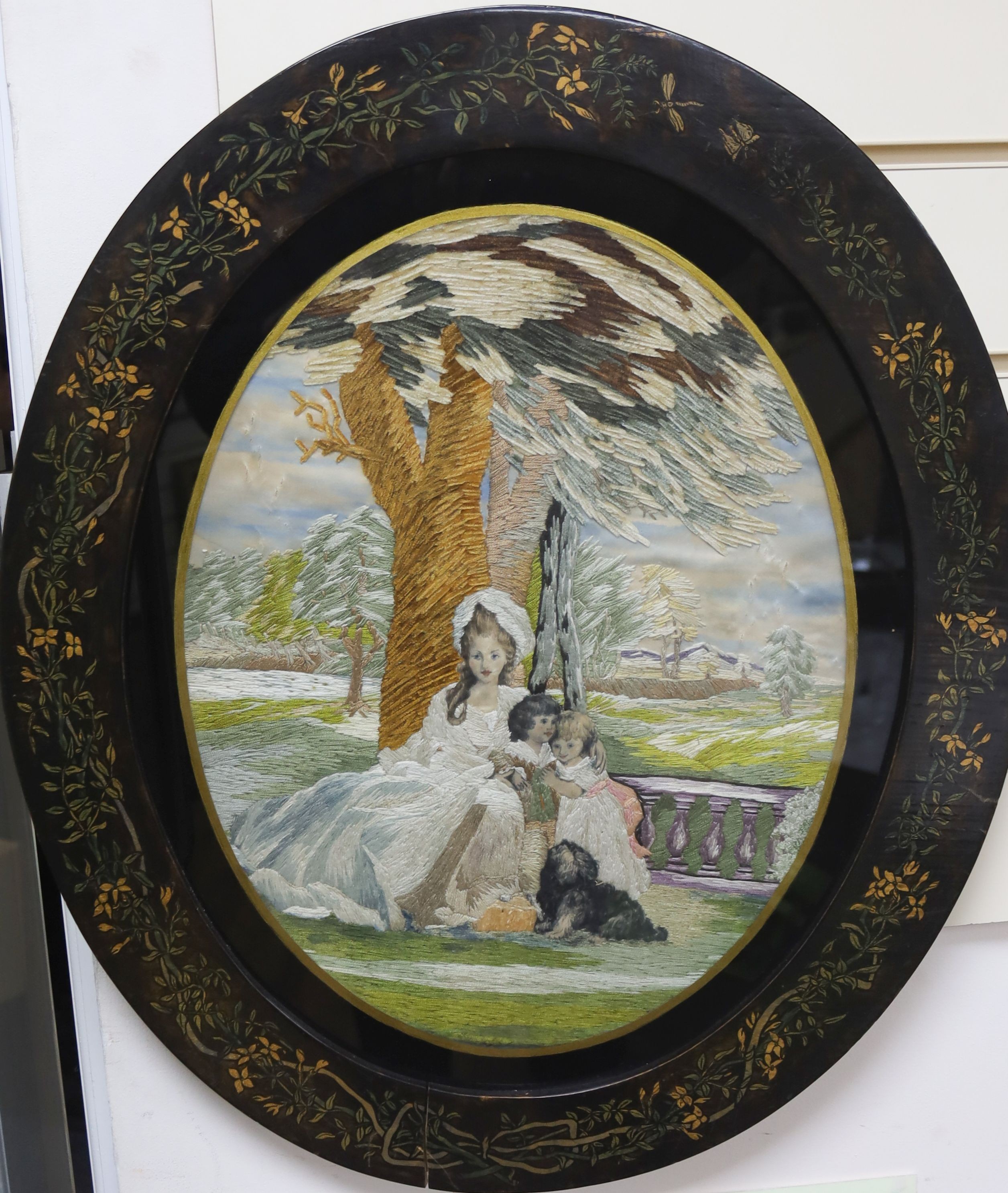 A framed oval Regency silk panel. 40cm long excl frame